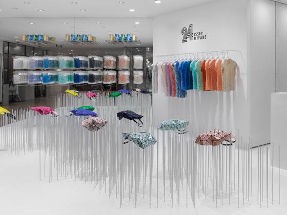Japanese design studio Nendo takes a concept-led approach to the design of the 24 Issey Miyake store in Tokyo’s Shibuya Parco, using clusters of steel rods to turn the functional display of goods into something far more sculptural