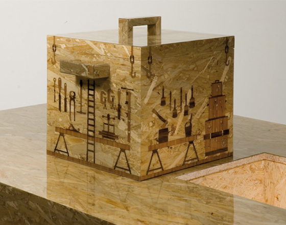 "Tools inlays" by Formafantasma for Droog Design; box integrated in a table, the inlays show the tools which were used to make the funriture piece of OSB wood