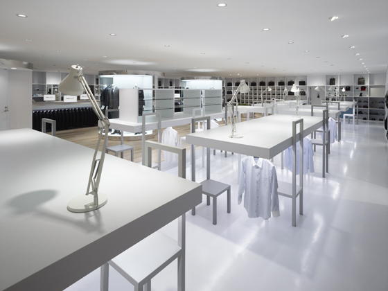 Japanese design studio Nendo have delivered a memorable concept for men’s suit brand Halsuit’s Okayama store, conflating retail space with office space. Its display system is made up playfully of conference tables, chairs and task lamps