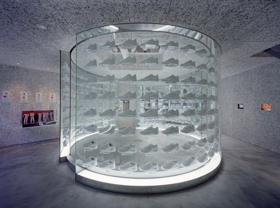 Torafu Architects’ design for the Nike 1Love store in Tokyo employs a cylindrical, glass display wall to define its interior space. Its transparency gives the impression that the products it houses are floating in air; photo Daici Ano